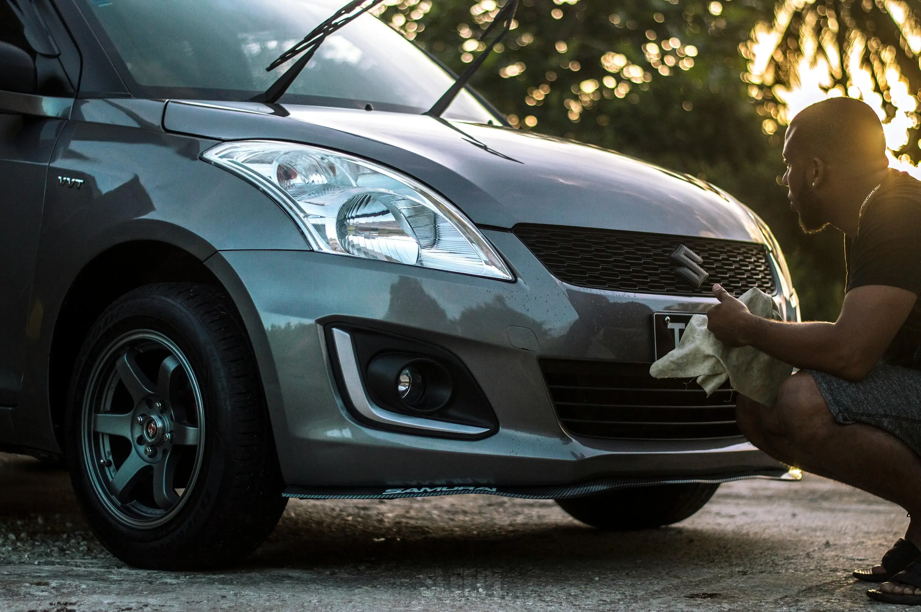 Professional Car Detailer Washing A Car